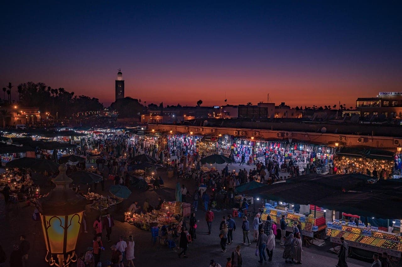 Marrakech medina at sunset with the Koutoubia minaret rising above the old city