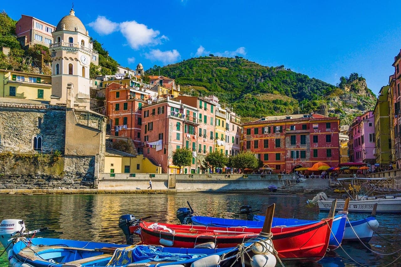 Colorful fishing boats lining the harbor of Fiumicino on the Tiber estuary near Rome