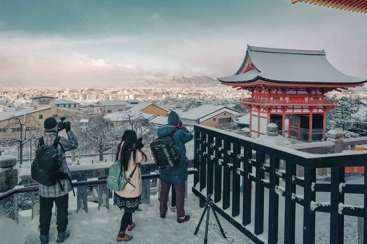 Snow-dusted view of Kiyomizu-dera temple on the Higashiyama hillside above Kyoto, Japan