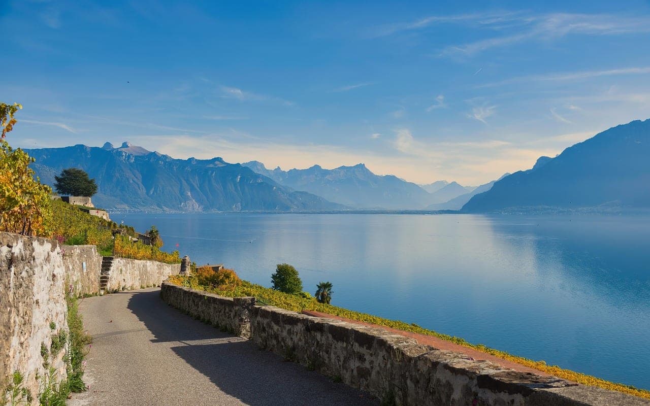 Lavaux vineyard terraces tumbling toward Lake Geneva — the landscape east of Lausanne