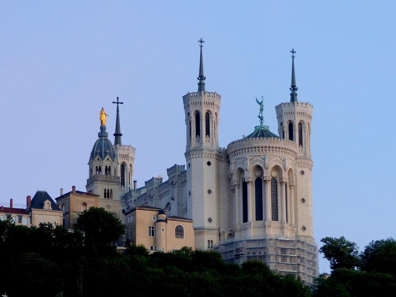 Basilique Notre-Dame de Fourvière watching over the rooftops of Vieux Lyon at sunset, France