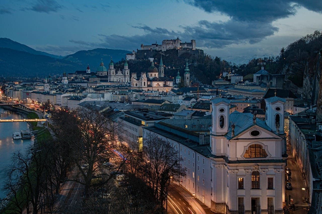 Hohensalzburg fortress on a hill above the baroque domes and rooftops of Salzburg Old Town Austria