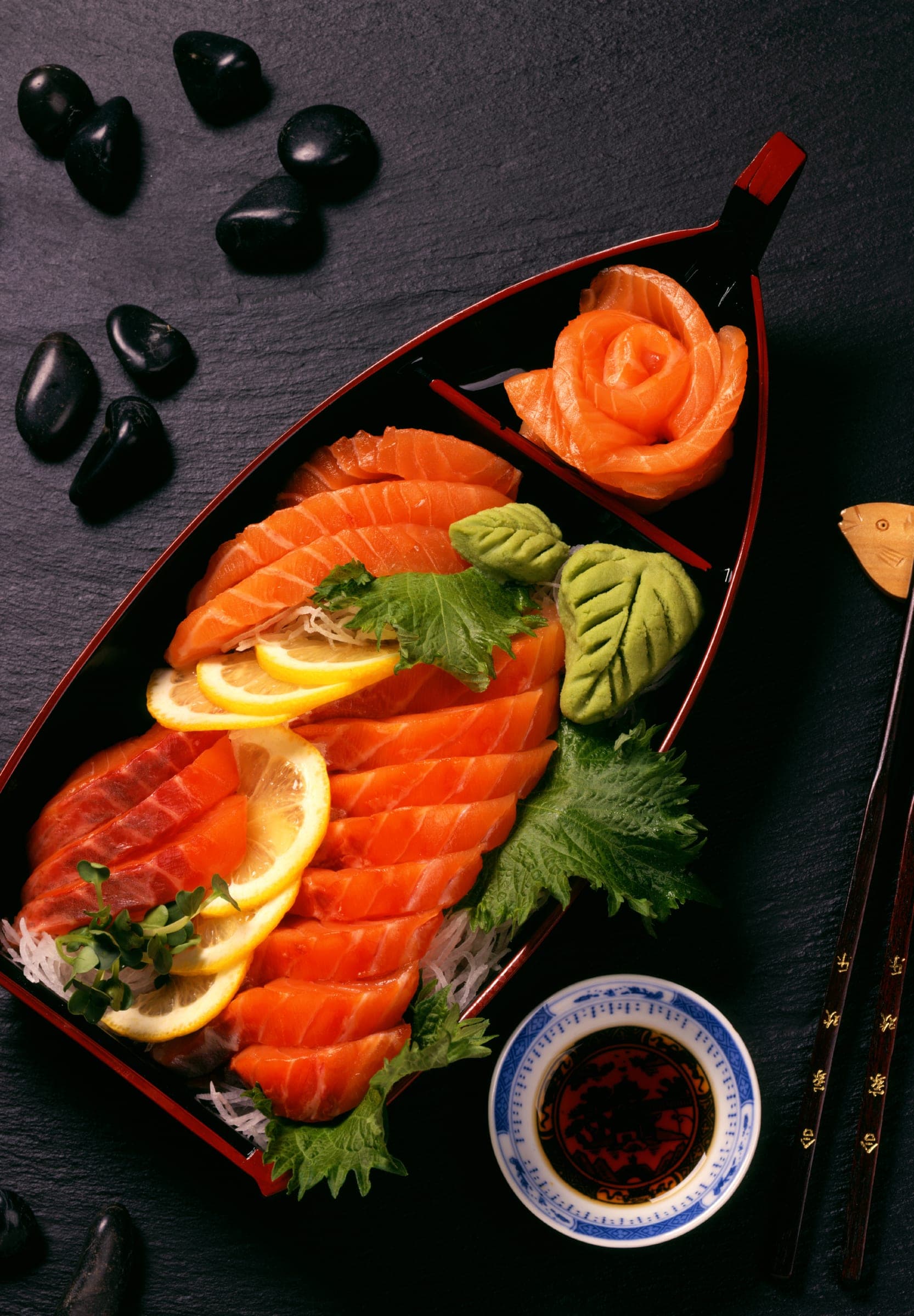 Sashimi served on a black volcanic stone