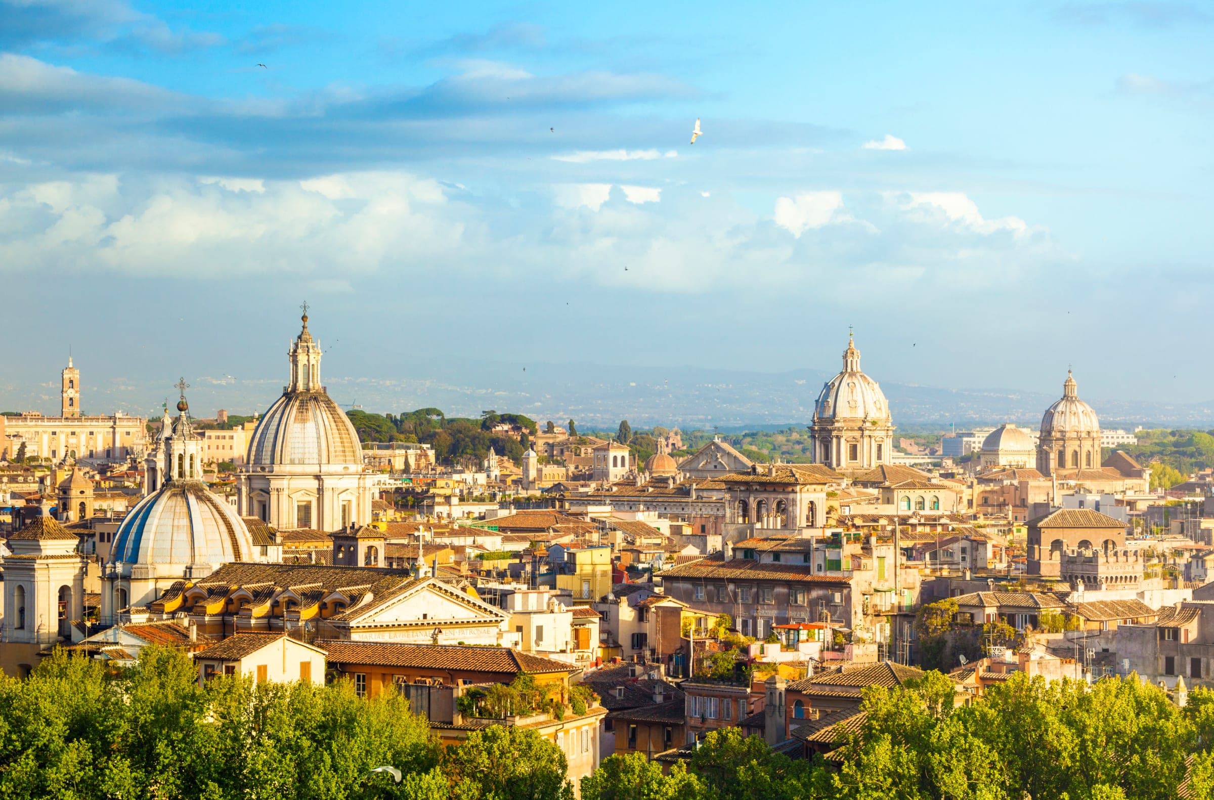 The domes and rooftops of Rome on a sunny afternoon