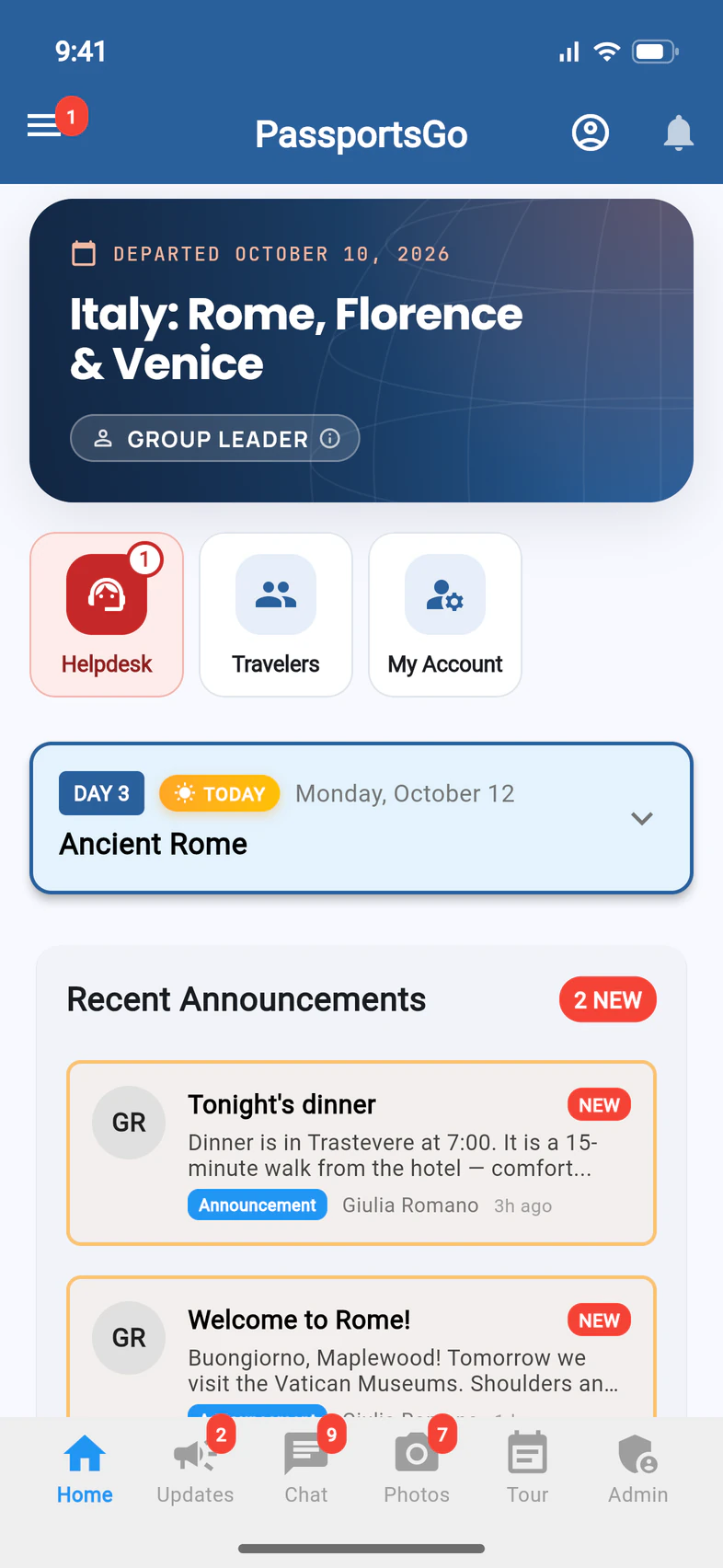 The PassportsGo Home screen for a group leader, with a red Helpdesk tile showing 1 next to the Travelers and My Account tiles