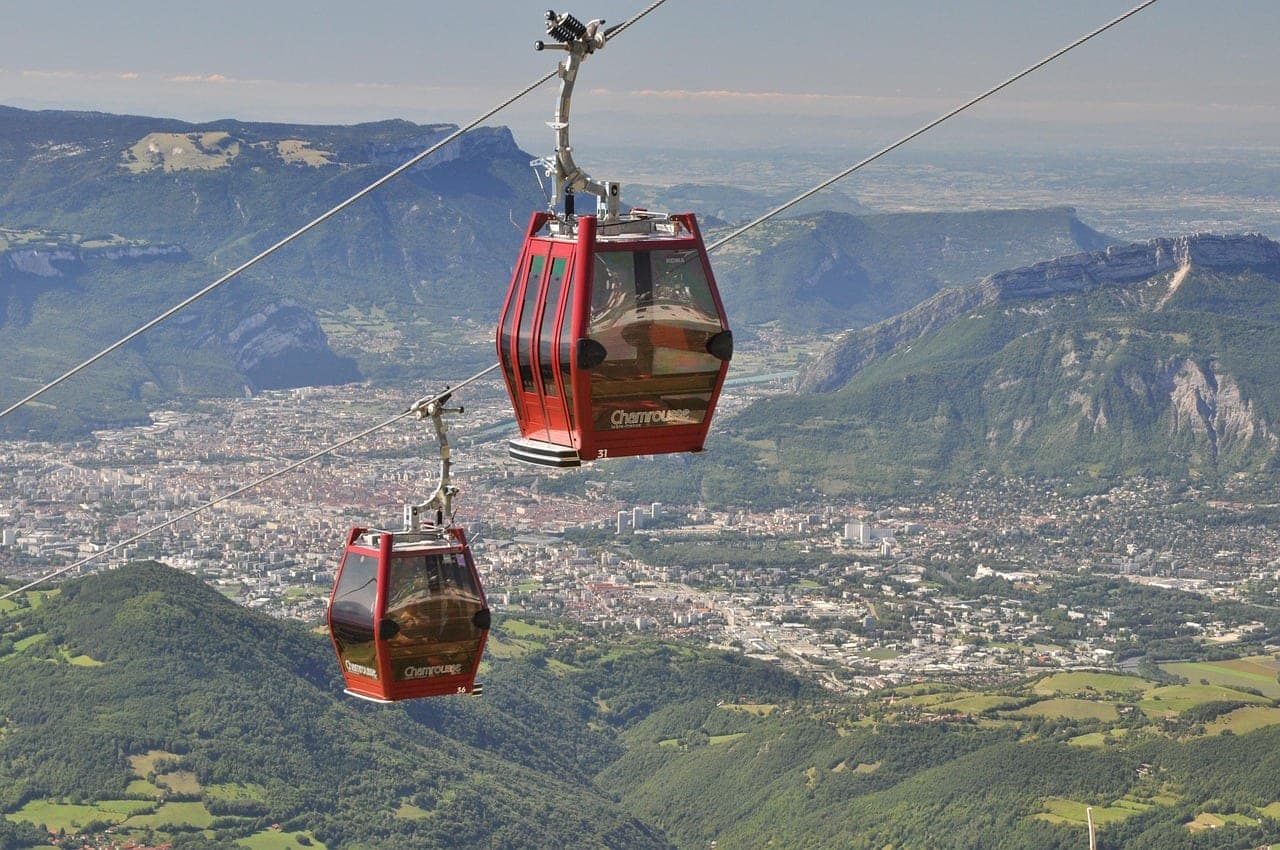 Grenoble's Bastille cable-car bubbles rising above the Isère river and the French Alps
