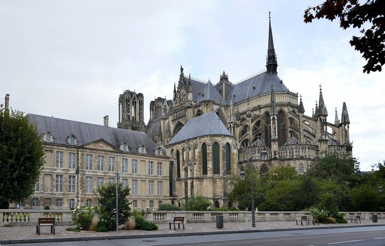 Western facade of Notre-Dame de Reims cathedral with its Gothic statuary, France
