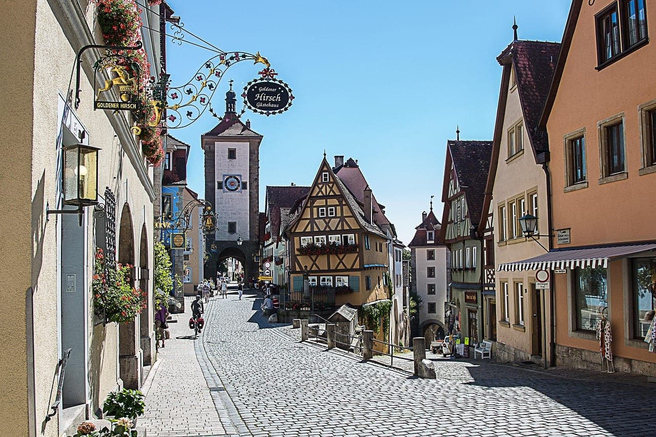 Rothenburg ob der Tauber's Plonlein corner with half-timbered houses framed by medieval town walls in Bavaria