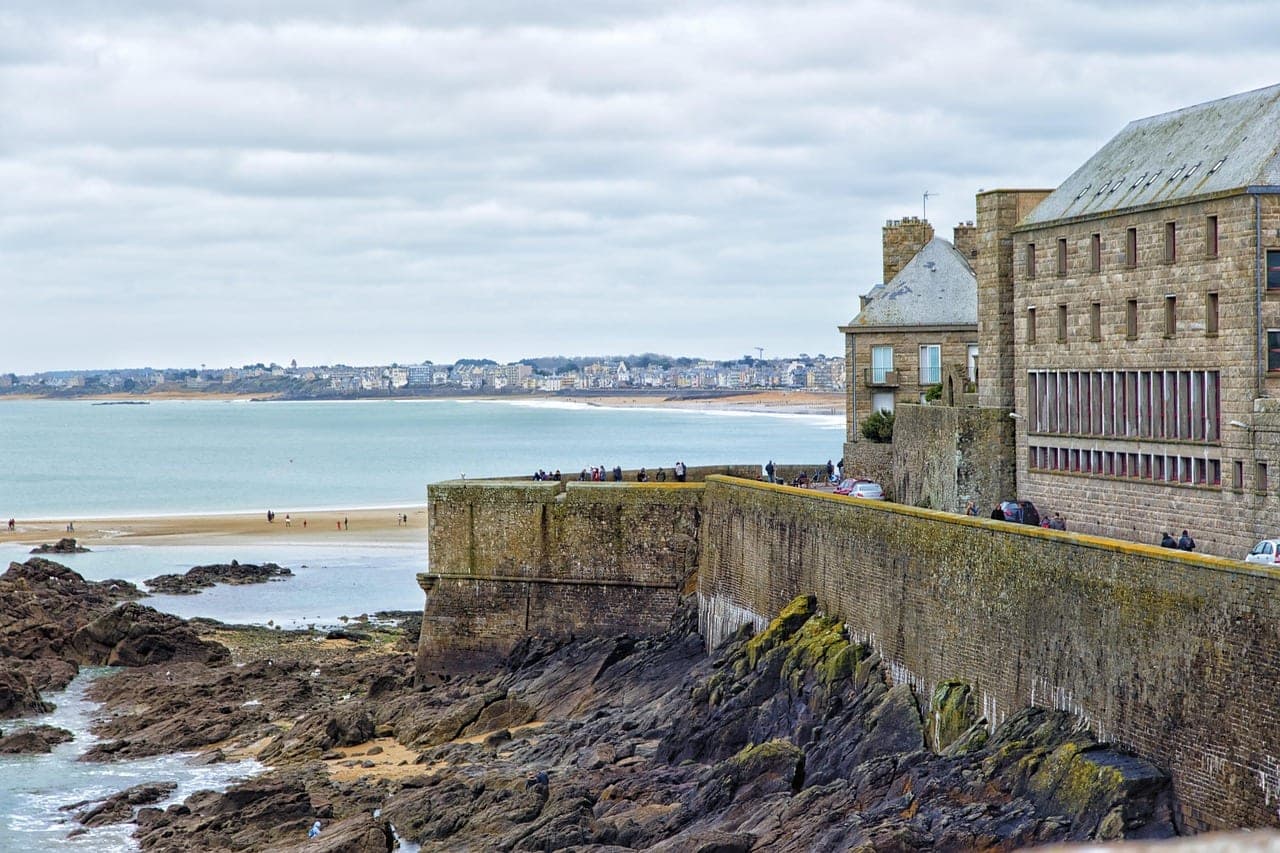Granite ramparts of the walled city of Saint-Malo above the English Channel beach, Brittany