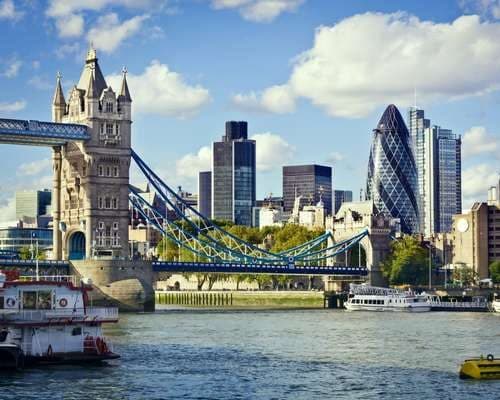 The London skyline at twilight along the Thames